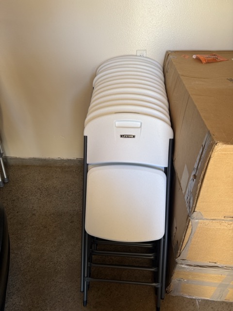 White plastic folding chairs